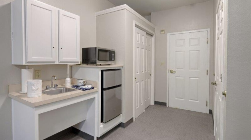 Cadence at Rivergate interior apartment hallway kitchenette and laundry area