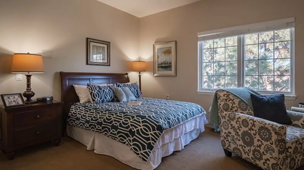 Interior bedroom with a queen bed at Cadence Lakewood, Colorado