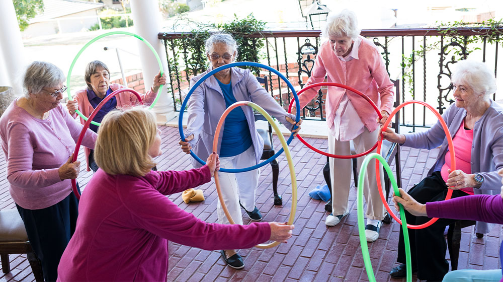 Photo of a senior women at a fitness class at senior living home